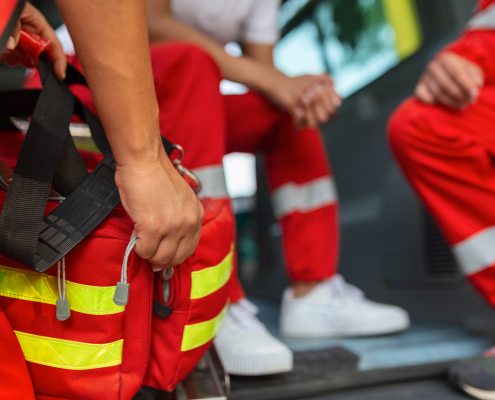 paramedic at the rear of the ambulance getting ready to respond to emergancy call